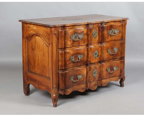 A mid-18th century French provincial walnut commode, the serpentine front fitted with three drawers, height 88cm, width 124cm