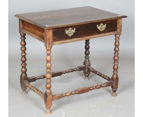 A 17th century and later walnut and oak side table, on bobbin turned legs, height 72cm, width 79cm, depth 52cm (alterations).