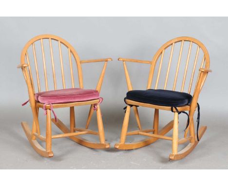 A pair of mid-20th century Ercol Windsor rocking chairs of small proportions, height 72cm, width 61cm.