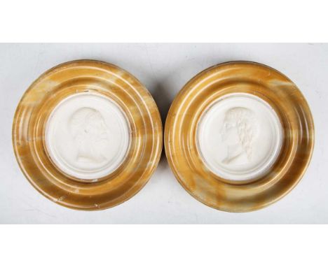 A pair of impressive late 18th/early 19th century Grand Tour carved Carrara marble tondo portrait plaques, mounted within Sie