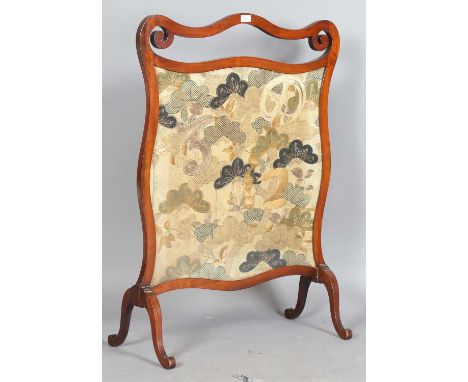 A large late 19th century mahogany framed firescreen, inset with a silkwork and metal thread panel, height 107cm, width 78cm.