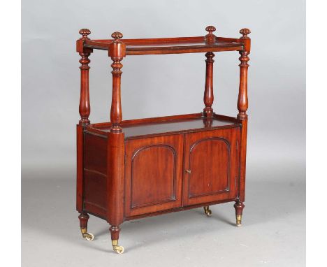 A mid-Victorian mahogany two-tier buffet with reeded finials and arched panel doors, height 110cm, width 88cm, depth 34cm.