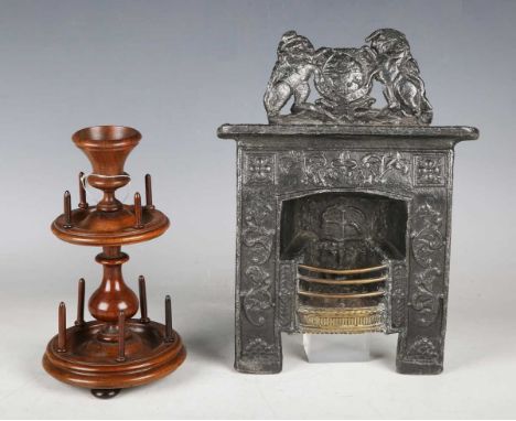 A Victorian turned walnut cotton reel stand, height 20cm, together with a Victorian lead and brass mounted model of a fire gr