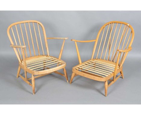 A near pair of mid-20th century Ercol easy chairs with hoop and stick backs, height 77cm, width 74cm and 68cm.