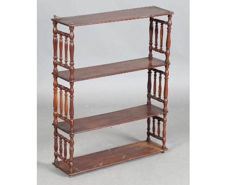 A 19th century mahogany four-tier wall shelf with turned spindle sides, height 80cm, width 65cm, depth 18cm.