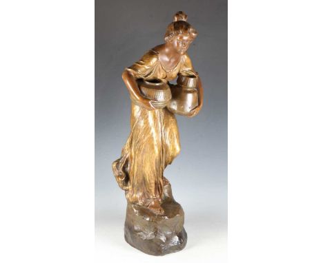 An Art Nouveau Goldscheider gilt patinated terracotta figure of a maiden holding water pots, her hair flowing around her shou