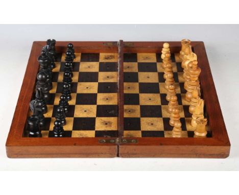 A late Victorian turned wooden St George pattern chess set, height of king 9cm, together with a travelling chessboard (some m