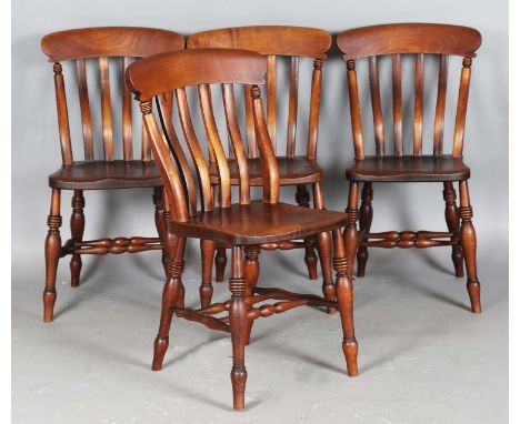 A good set of four Victorian ash and elm bar back kitchen chairs with solid seats, on ring turned legs, stamped maker's initi