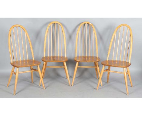 A set of four Ercol beech and elm hoop back Windsor dining chairs, height 96cm, width 42cm.