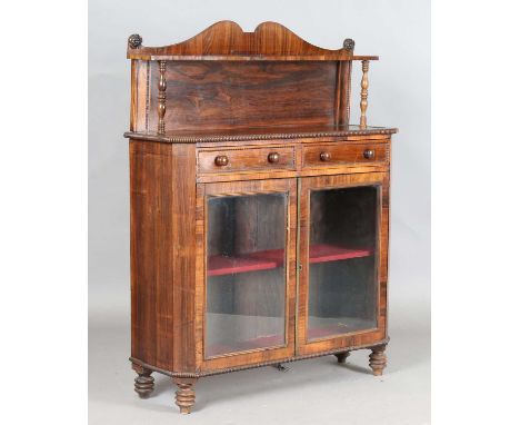 A Regency rosewood chiffonier, the shelf back above two drawers and two glazed doors, height 130cm, width 102cm, depth 35cm.