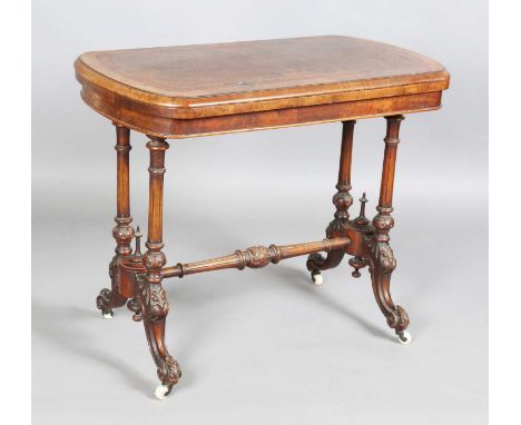 A late Victorian burr walnut fold-over card table, raised on carved supports, height 73cm, width 93cm, depth 50cm (some fault