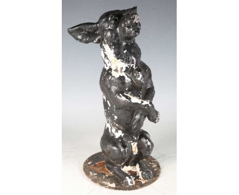 A 19th century cast iron model of a begging dog, formerly part of a stick stand, height 39cm.