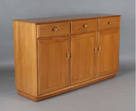 A modern Ercol pale elm sideboard, height 94cm, width 156cm, depth 44cm.
