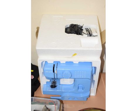 A small sewing machine, boxed