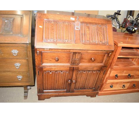 An oak front bureau