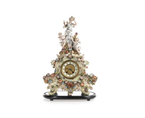 GERMAN PORCELAIN MANTEL CLOCK LATE 19TH CENTURY  with twin train eight day movement, the white enamal chapter ring with Arabi