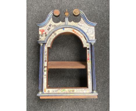 An antique mahogany longcase clock hood with decoupage decoration 
