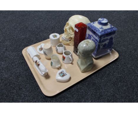 A tray of nine pieces of early 20th century crested china, resin skull, phrenology head, Whitefriars style vase, Ringtons Mal