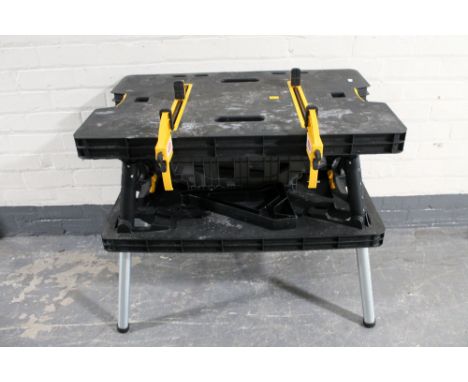 A Ketter folding work bench with vice