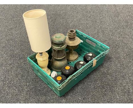 A box of three vintage lawn bowls, paraffin tilly lamp, brass oil lamp base, alabaster lamp with shade 