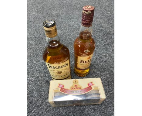 A bottle of Bell's Scotch Whisky 70cl together with a boxed bottle of Teacher's Highland Cream Scotch Whisky 70cl and a furth