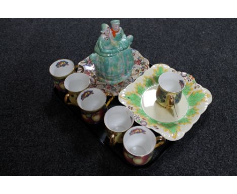 A tray of Maling brown chintz plate, Clarice Cliff Newport pottery dish, six Orchard Fruit china mugs, Arthur Wood biscuit ba