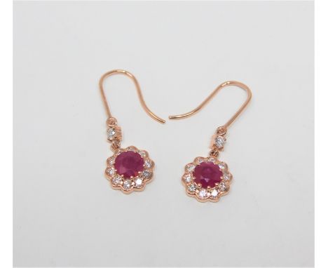 A pair of 14ct rose gold ruby and diamond earrings, the rubies weighing 2.22 carats in total, the diamonds 0.60ct. With certi