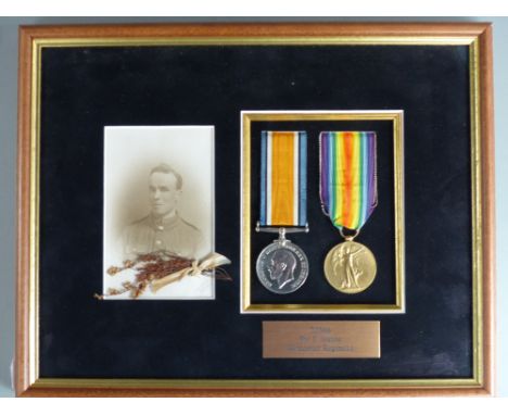 British Army WWI medals comprising War Medal and Victory Medal named to 32566 Pte E Atkins Gloucestershire Regiment, with pho