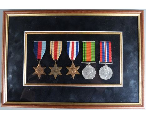 British Army WWII mounted and framed medals comprising 1939/45 Star, Africa Star, France &amp; Germany Star, Defence and War 