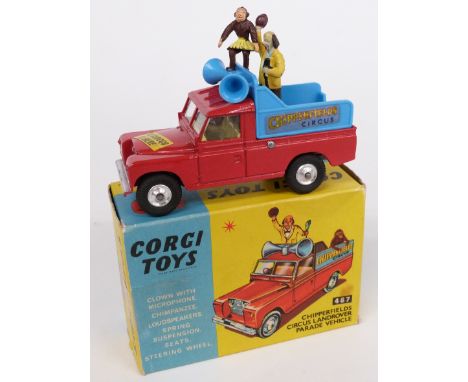 Corgi Toys diecast model Chipperfields Circus Landrover Parade Vehicle with red body, lemon interior, blue back, figure and m