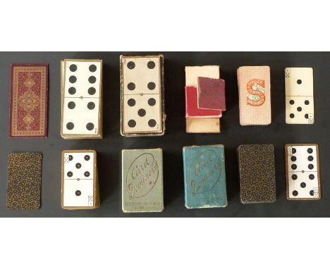 English playing cards by various makers. Four sets of domino cards by De La Rue, Goodall, International Card Co, London and S