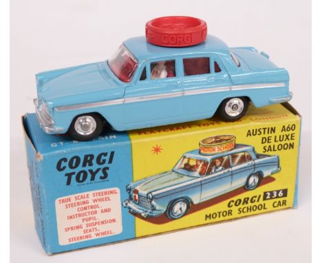 Corgi Toys diecast model Austin A60 De Luxe Saloon Corgi Motor School Car, with pale blue body, red interior, driver and inst