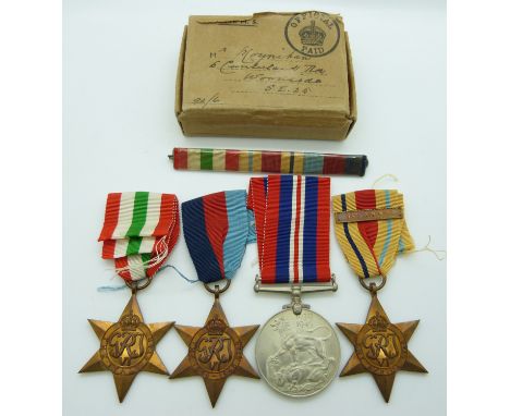 WWII medals comprising 1939/45 Star, Africa Star, Italy Star and War Medal with bar for 1st Army, in box addressed to Mr Moyn