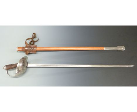 Replica 1912 pattern British cavalry sword in leather scabbard, blade length 90cm.&nbsp;