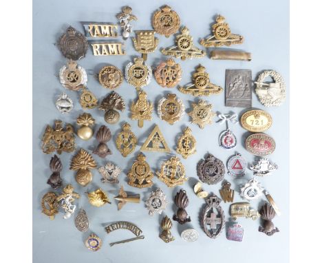 A collection of British Army cap badges including Royal Engineers, Royal Artillery, Intelligence Corps etc