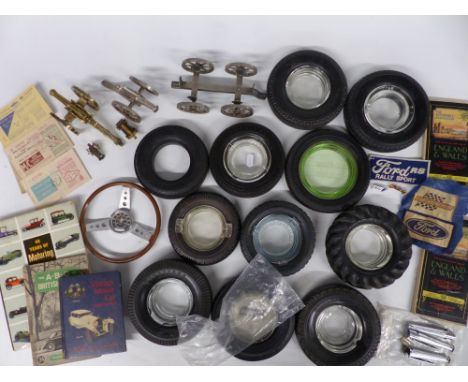 Quantity of motoring collectables including Firestone tyre ashtrays, AA maps, model cannon, books, steering wheel thermometer