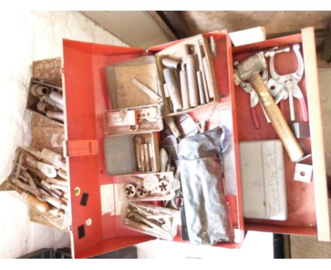 A quantity of tools to include taps and dies, wad punches etc