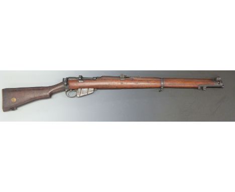 Deactivated Short Magazine Lee Enfield SMLE .303 bolt action rifle with ladder sight, brass butt plate with storage compartme