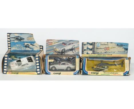 Three Corgi James Bond 007 diecast model vehicles Lotus Esprit 269, Aston Martin 271 and Stromberg Helicopter 926, all in ori