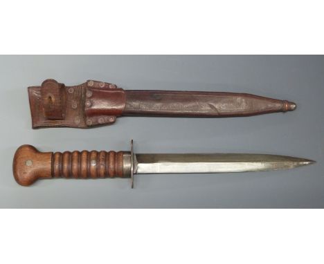 WWI Dutch fighting knife with wooden handle and 20cm double edged blade, in leather scabbard with integrated frog.&nbsp;