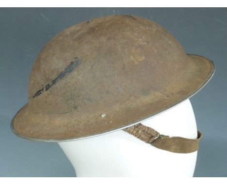 British Army WWII 'Brodie' steel helmet with liner and chin strap, the rim stamped JSS127 I 1939, named to strap D Hygate