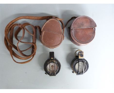 WWII two prismatic compasses, one by GEC no B 144249, dated 1939, the other by TG &amp; Co Ltd, London, no 36883, MKIII, date