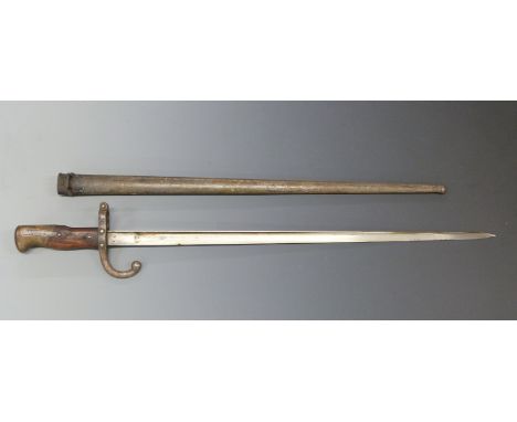 French 1874 Model T bayonet with 52cm blade and stamped 97087 to the quillion, in metal scabbard.&nbsp;