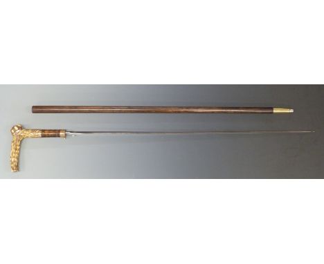 A 19thC sword stick with yellow metal mounts and deer horn handle and 71cm fullered blade.&nbsp;