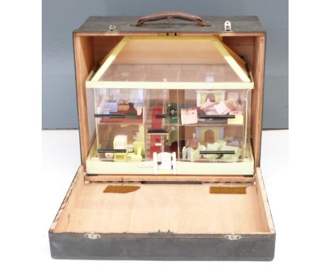 Perspex / acrylic dolls house or exhibition house with similar scale model furniture and people. In fitted case, possibly exh