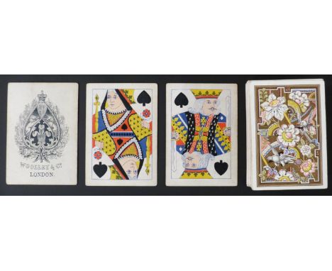 Woolley & Co, London playing cards. Standard double ended courts, square corners, no indices, one way numerals. Decorative fl