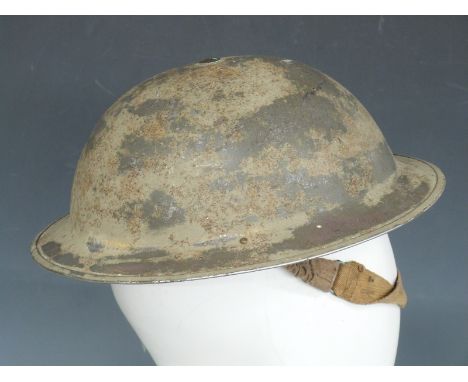 British Army WWII 'Brodie' steel helmet stamped JSS 1940 with liner and chinstrap