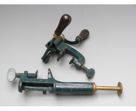 Two 12 bore steel and brass shotgun cartridge reloading tools.&nbsp;