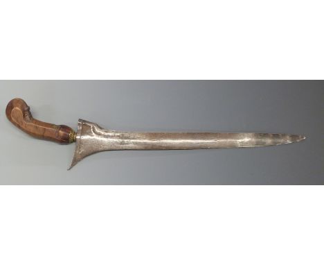 Sumatran Kris dagger with 35cm Damascus blade, carved handle and gilt mendak, overall length 46cm.
