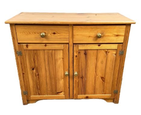 A pine side cabinet with two drawers over single storage space with shelf, 81 x 97 x 43 cm.